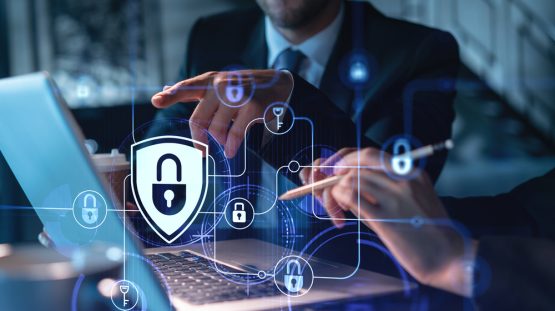 Two,Colleagues,Working,Together,To,Protect,Clients,Confidential,Information,And Two,Colleagues,Working,Together,To,Protect,Clients,Confidential,Information,And